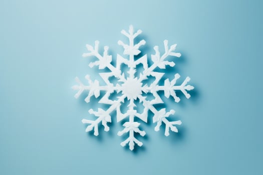 Detailed shot of DIY snowflakes on New Year isolated on a gradient background photo