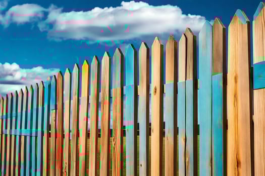 a wooden fence with blue sky and clouds. AI-Generated photo