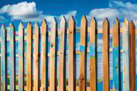 a wooden fence with blue sky and clouds in the background. AI-Generated photo