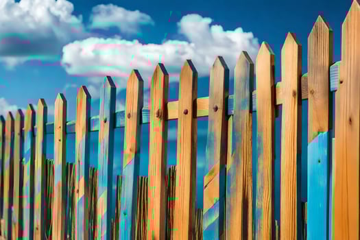 a wooden fence with blue paint on it. AI-Generated photo