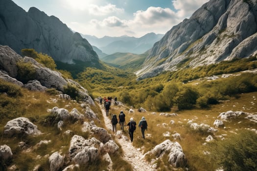A thrilling shot of a group of hikers trekking through the rugged terrain of a Croatian national park, with majestic mountains in the background. Generative Ai photo