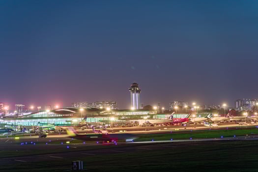 Ho Chi Minh, Vietnam - 7 August 2023 Airlines fly past landmark 81, the tallest building in Vietnam, to land at Tan Son Nhat international airport. photo