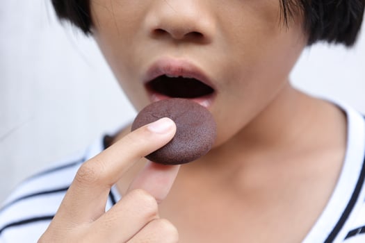 Close-up view of mouth eating food photo