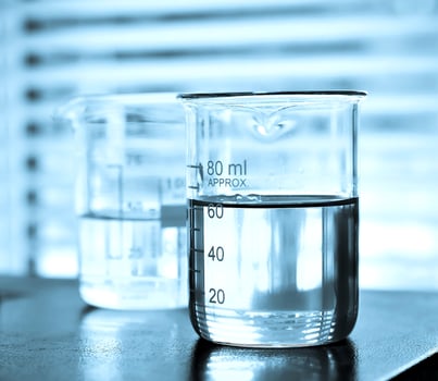 Laboratory glassware at lab background in blue tone photo