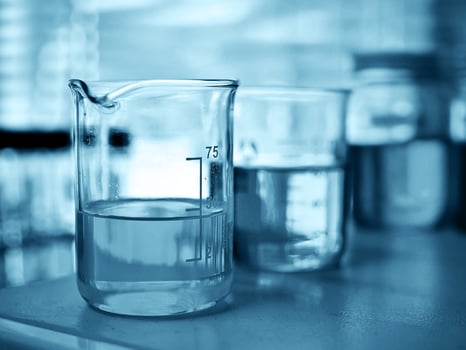 Laboratory glassware at lab background in blue tone photo