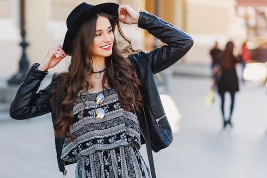 Beautiful amazing brunette woman with long wavy hairstyle in spring or fall stylish  urban outfit walking  on the street. Red lips, slim body. Street fashion concept. photo
