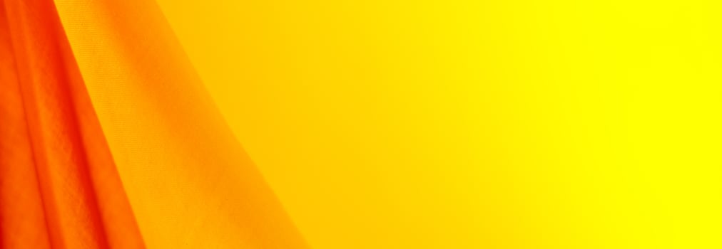 Yellow wavy fabric banner background photo