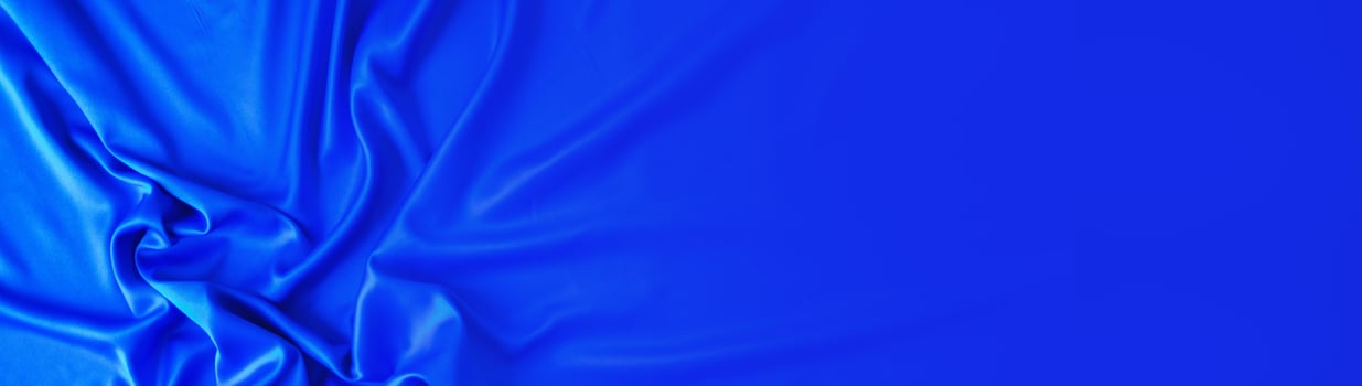 blue silk background. abstract banner copy space photo