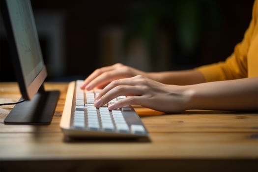 A womans hands busy on the keyboard, engrossed in typing AI Generated photo