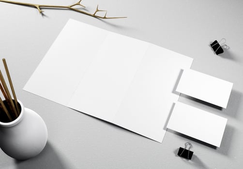 Blank trifold brochure and 2 business cards with concrete background, great for brochure mockups. photo