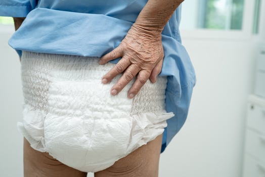 Asian senior woman patient wearing incontinence diaper in hospital, healthy strong medical concept. photo