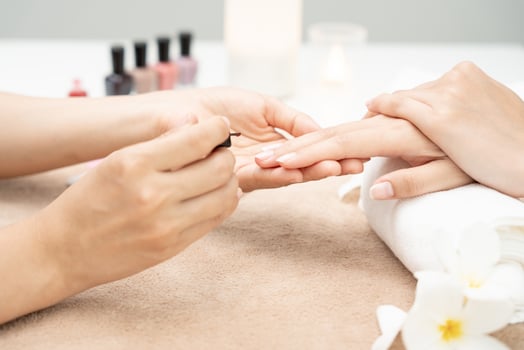Woman receive care service by professional Beautician Manicure at spa centre. Nail beauty salon use nail file for Glazing treatment. manicurist make nail customer to beautiful. body care spa treatment photo