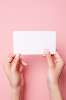 Female hands with blank business card or discount card on Flat color background with copy space AI Generated photo