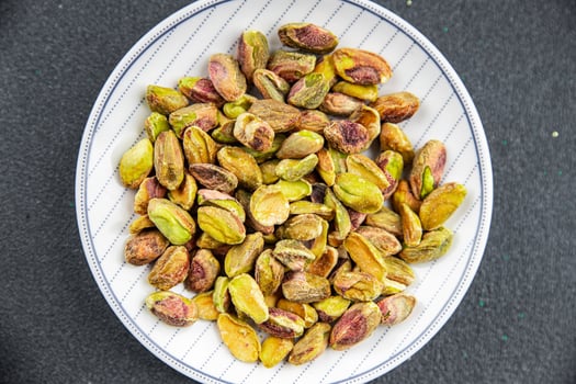 pistachios peeled without shell delicious nut delicious healthy eating cooking appetizer meal food snack on the table photo