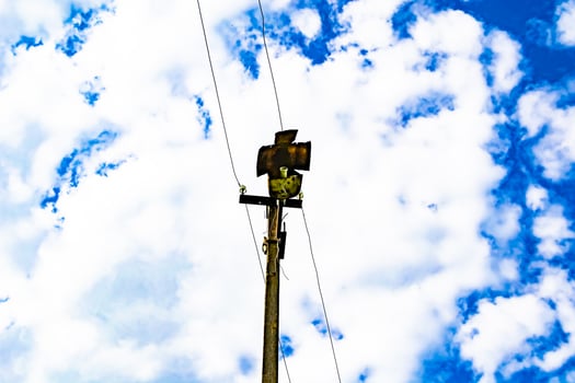 Power electric pole with line wire on colored background close up photo