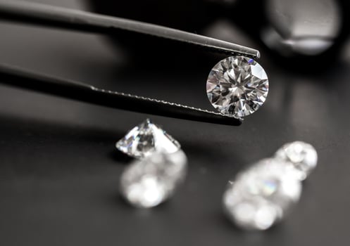 Diamond in jewelry tweezers photo
