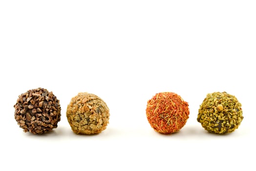 Handmade chocolate candies on white background photo