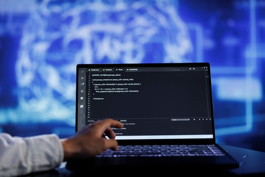 Admin writes code on laptop to visualize artificial intelligence neural networks using augmented reality technology, close up. Expert running AI script for data processing, blurry background photo