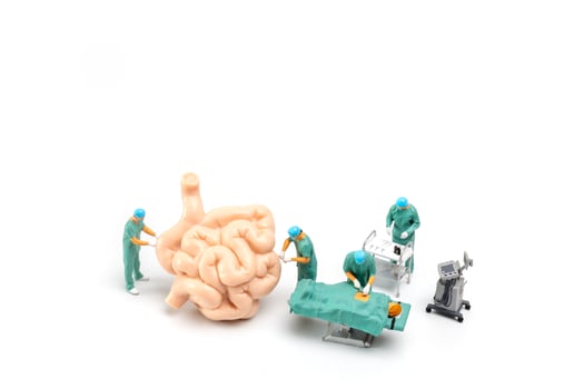 Miniature Doctor and nurse medical team are performing surgical operation at emergency room photo