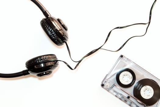 Audio cassette tape and headphone, isolated photo