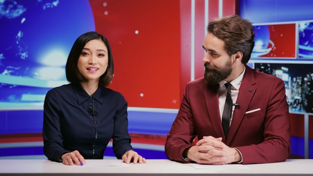 Diverse presenters hosting morning show to cover all news stories on global television network, international program. Man and woman journalists presenting media segment live on tv panel. photo