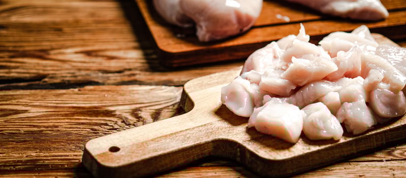 Sliced chicken fillet. On cutting board. photo