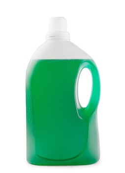 Green liquid soap or detergent in a plastic bottle photo