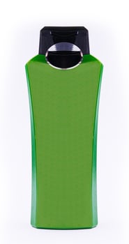 Green shampoo bottle isolated on white background photo