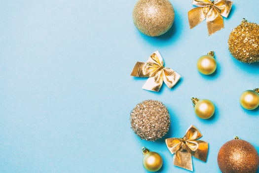 Top view of festive winter composition on colorful background with empty space for your design. Christmas baubles and decorations. New Year concept photo