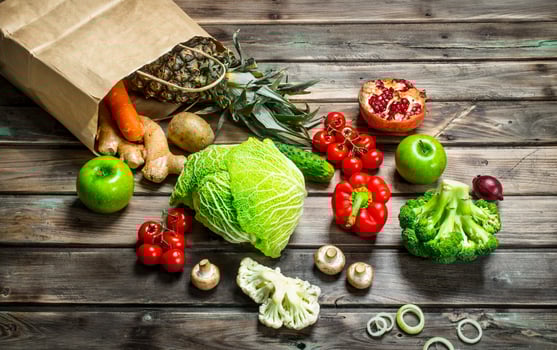 Organic food. Food package with healthy vegetables and fruits. photo