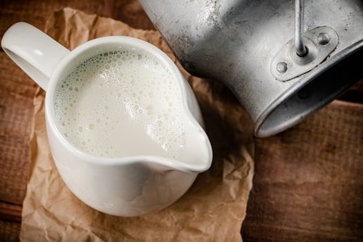 A jug of fresh milk on the table. photo