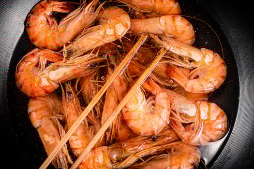 The shrimp are cooked in a pot of water. photo