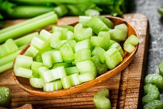 Sliced celery on a cutting board. photo