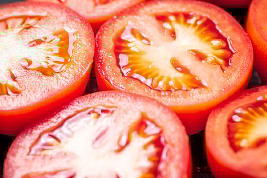 A round piece of tomato. Macro background. photo
