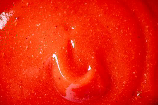 Catsup. Macro background. The texture of tomato sauce. photo