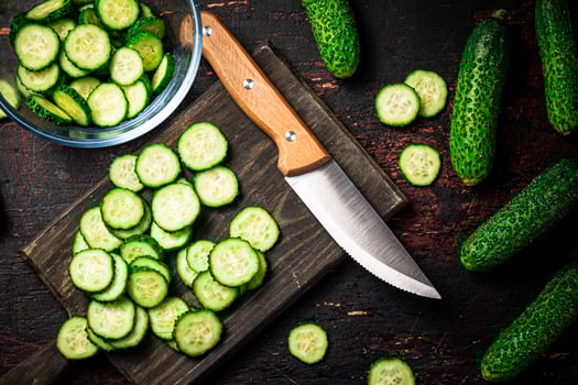Cucumbers cut on a cutting board. photo