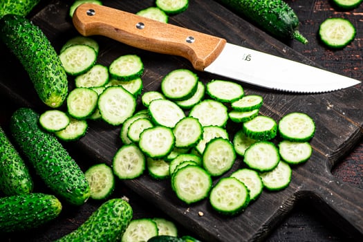Cucumbers cut on a cutting board. photo