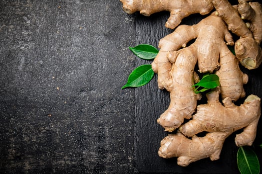 Fresh ginger root with leaves. photo