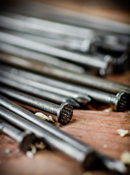 A bunch of nails on the table. photo