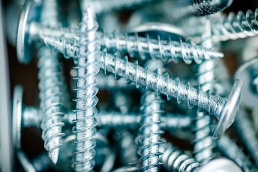 A pile of bolts. Macro background. photo
