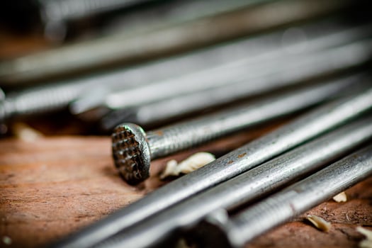 A bunch of nails on the table. photo