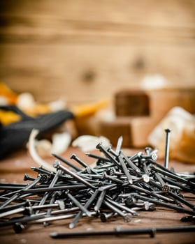 Construction nails on the table. photo