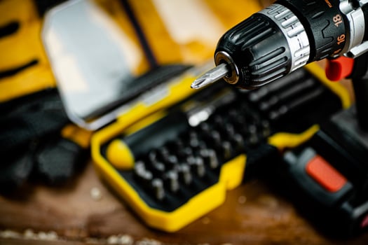 Working tools. Screwdriver bits. On a wooden background. photo