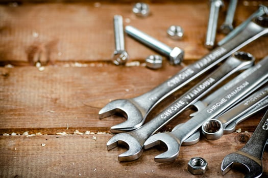 Wrenches with nuts on the table. photo