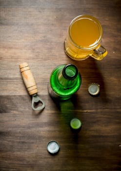 Beer in a glass mug and a bottle. photo