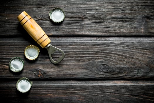 Opener with covers from beer bottles. photo