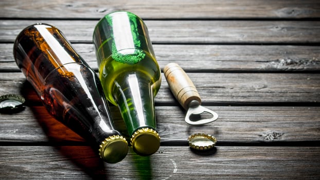 Beer in glass bottles and opener. photo