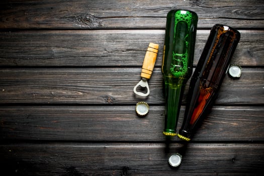 Beer in glass bottles and opener. photo