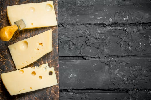Fresh pieces of cheese on the Board. photo
