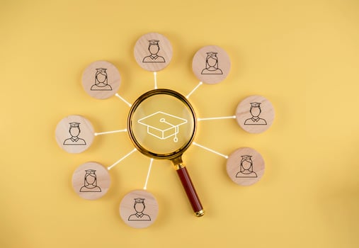 Magnifying glass focus with Male and female student icons on wooden blocks,virtual screen, internet lessons and online webinar, online lessons on a digital screen.Education internet Technology. photo